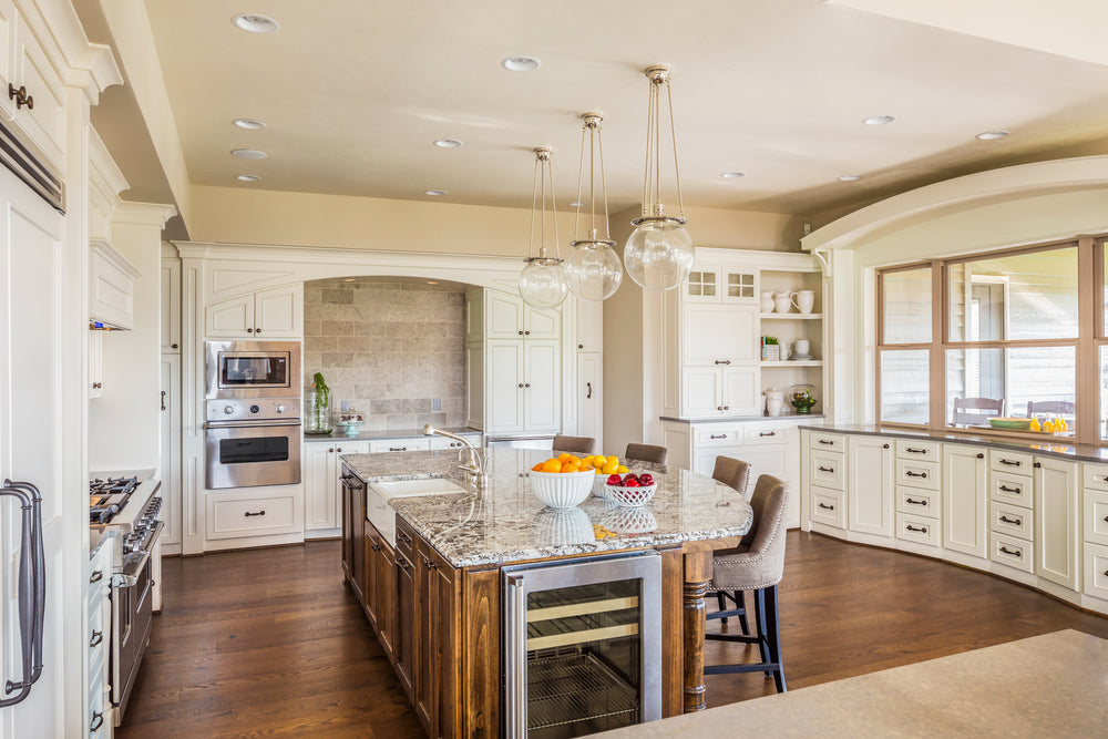 Beautiful Kitchen Interior in Luxury Home with Island, Hardwood Floors, and Elegant Cabinetry